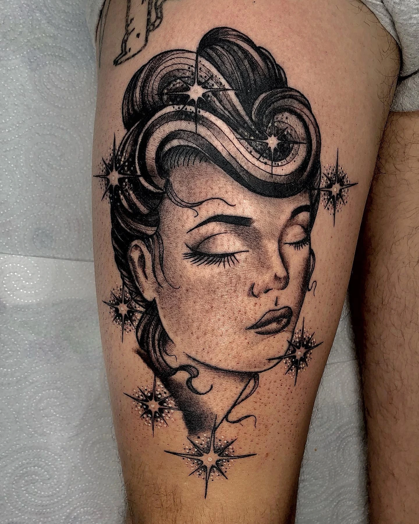 Art-deco woman portrait with pin-up hair and starbursts