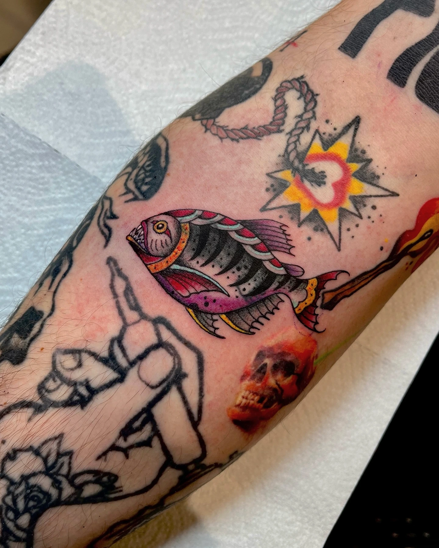 Traditional fish, hand with finger, candle, sparkle — small flash collage