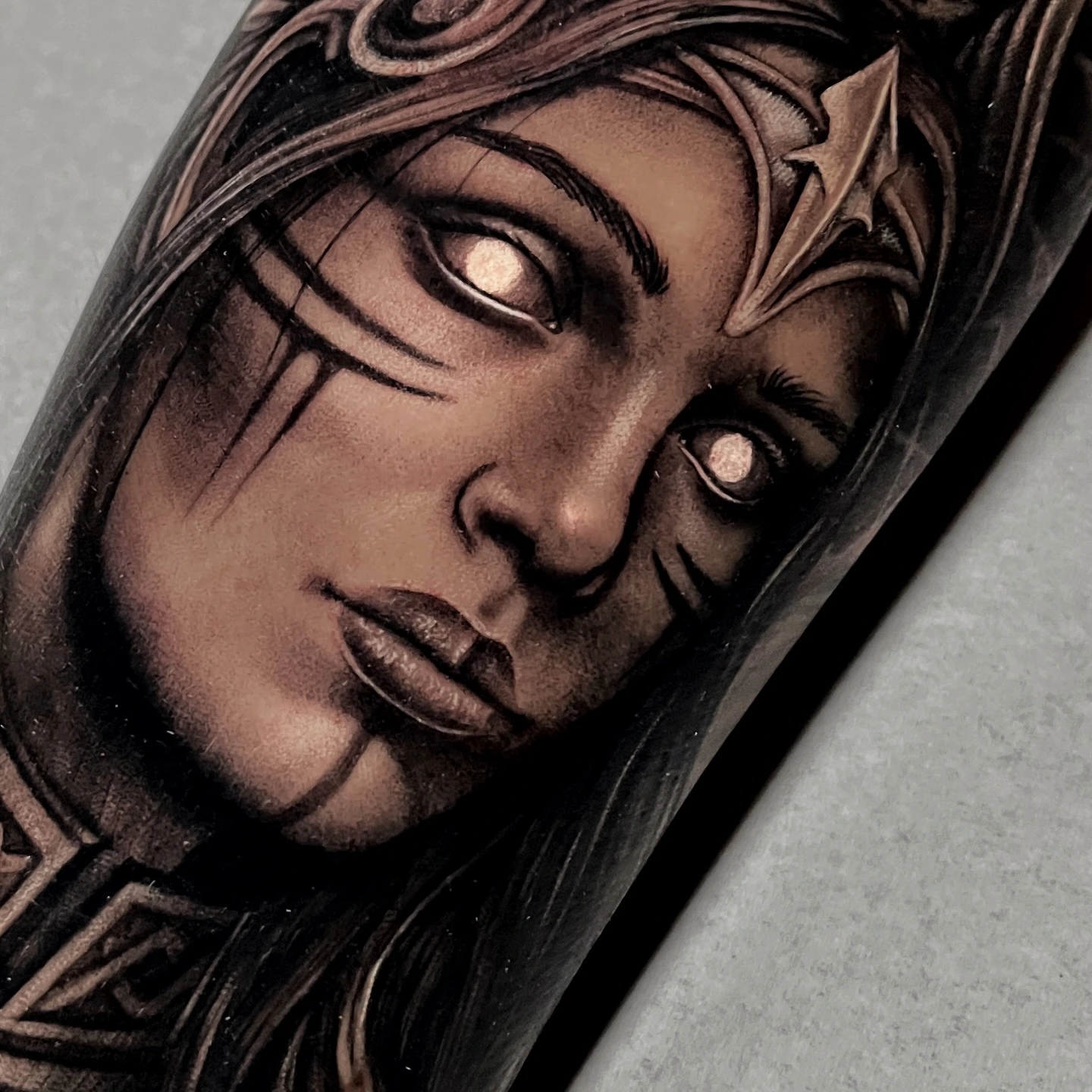 Valkyrie face close-up with glowing eyes and ornamental headdress