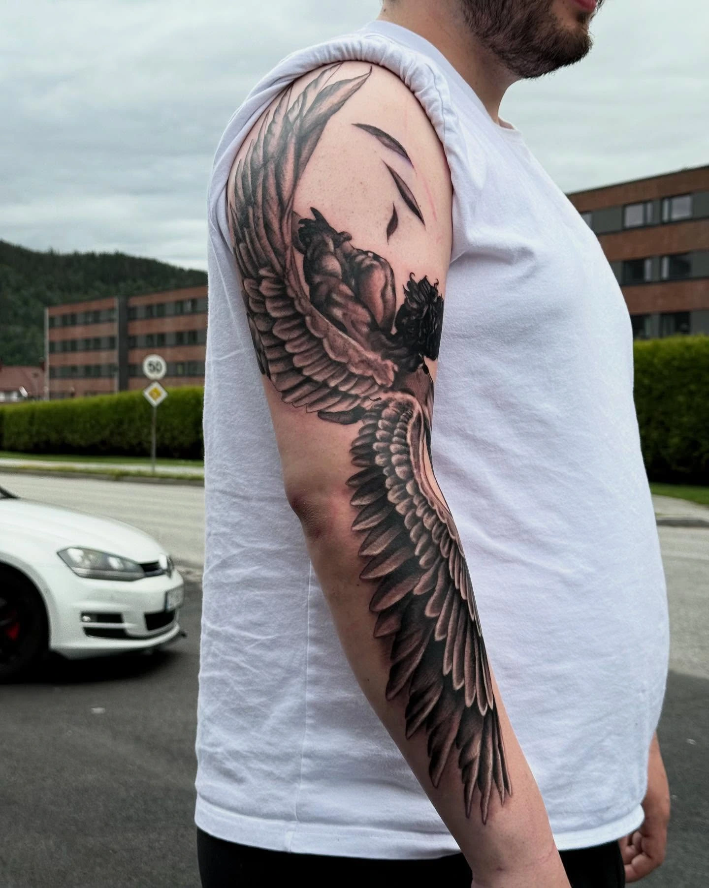 Fall of Icarus winged angel arm sleeve (street angle)