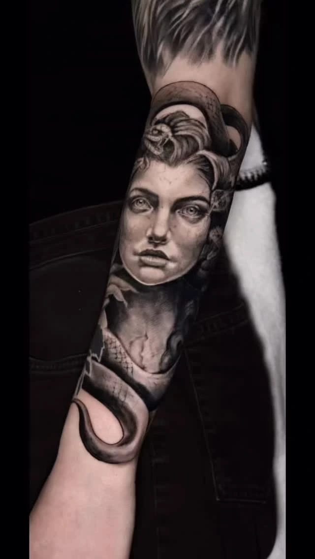 Medusa portrait with snake & cracked-stone bust