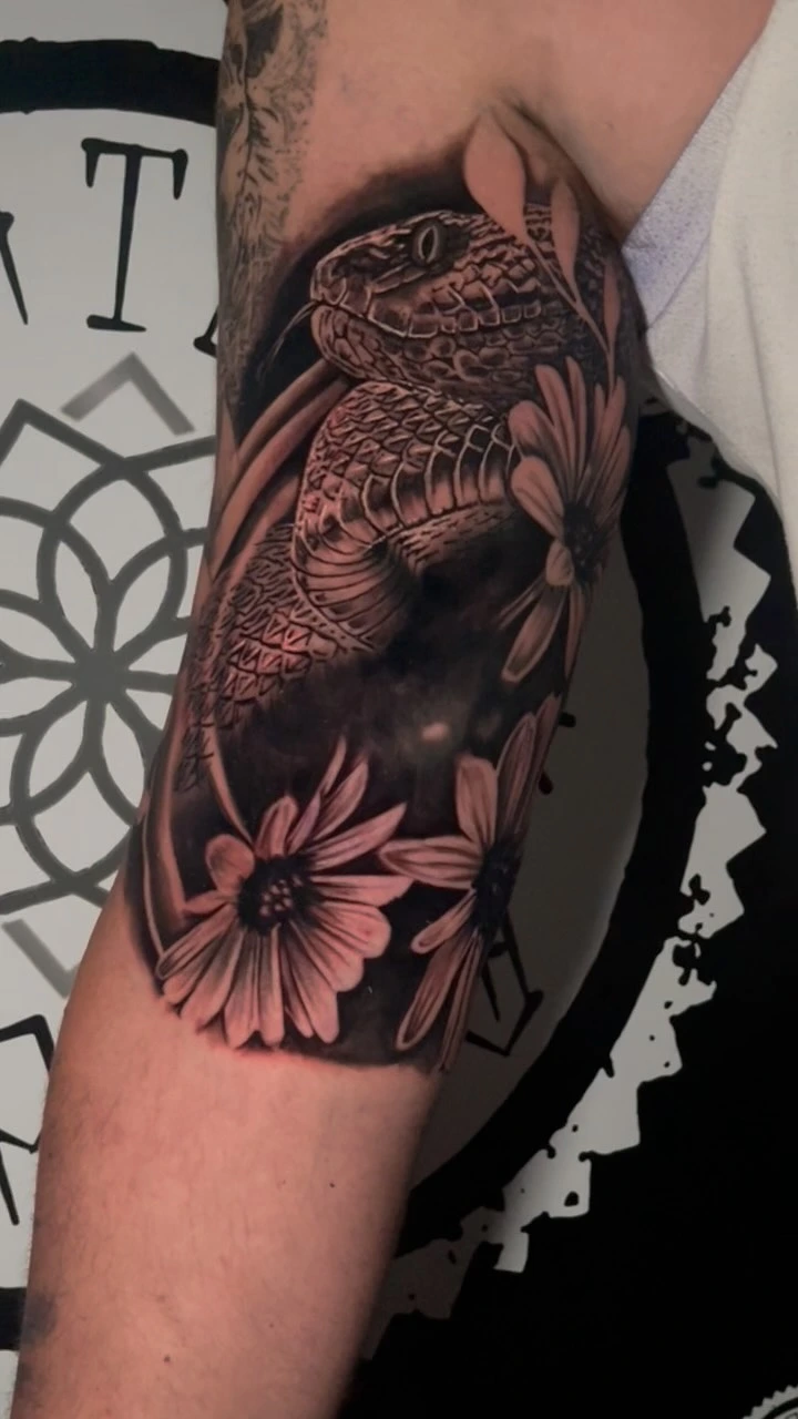 Coiled snake/cobra with daisies, photoreal head with single red blood-drop accent