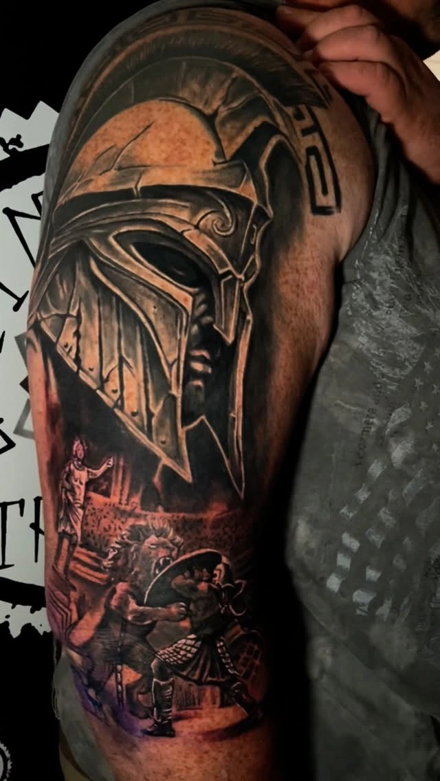 Spartan helmet with gladiator combat scene below