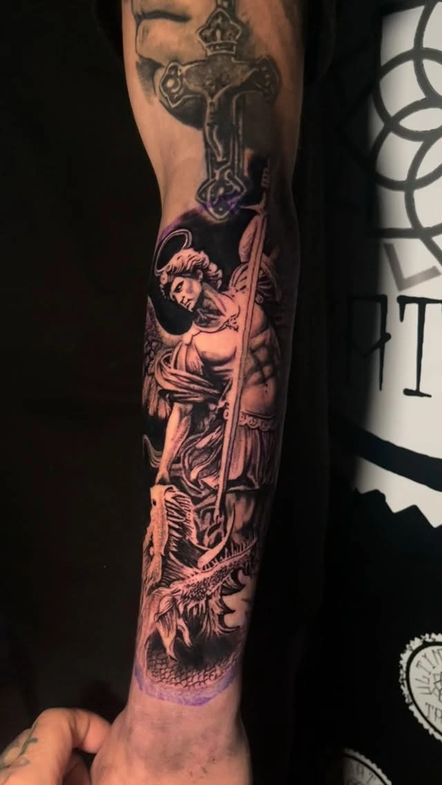 Archangel Michael with spear slaying serpent, Christian crucifix above