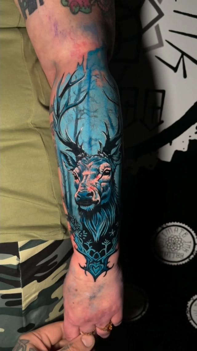 Color stag/deer head in turquoise/blue forest with antlers